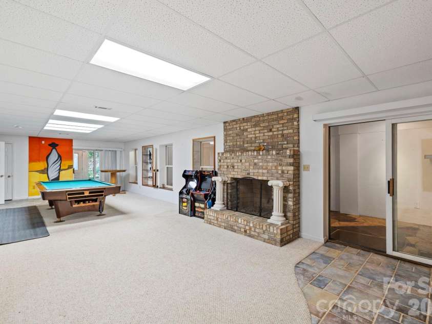 652 Avery Creek Road, Arden, NC 28704.  MLS# CAR4282113, YatesRealty ID 15716. Lower level game room