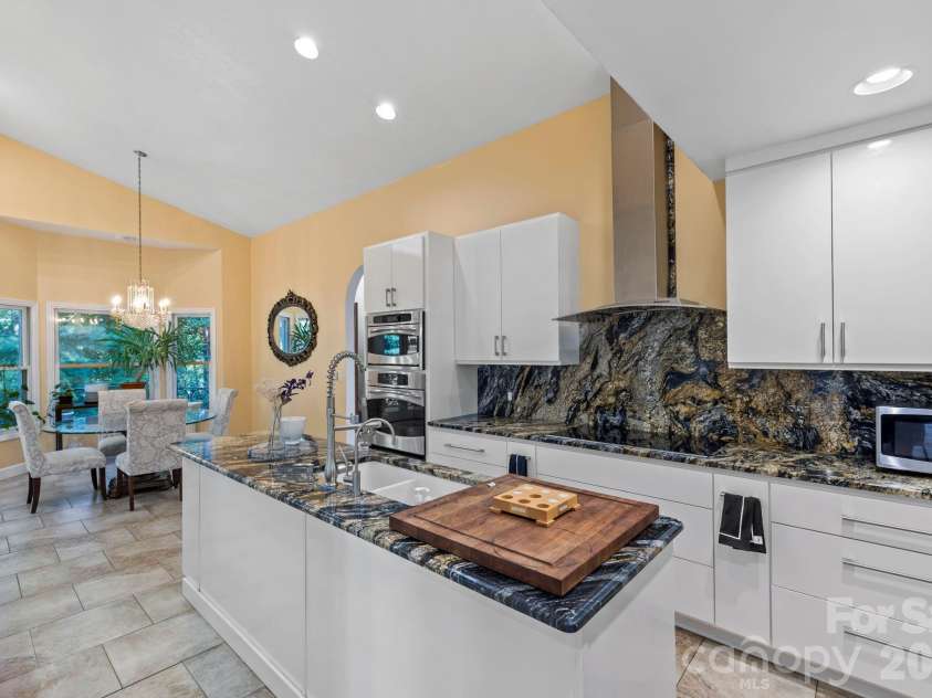 652 Avery Creek Road, Arden, NC 28704.  MLS# CAR4282113, YatesRealty ID 15716. Main level kitchen