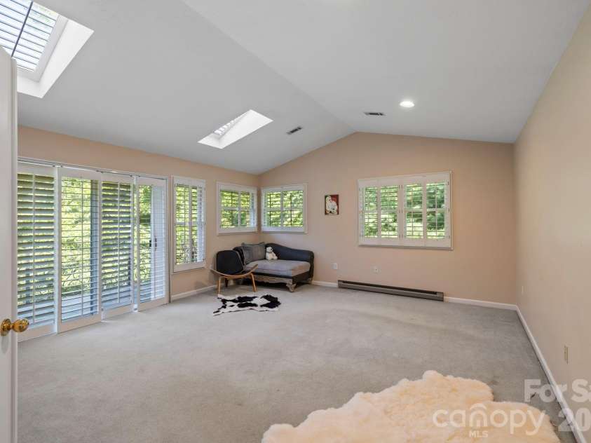 652 Avery Creek Road, Arden, NC 28704.  MLS# CAR4282113, YatesRealty ID 15716. Upper level primary bedroom