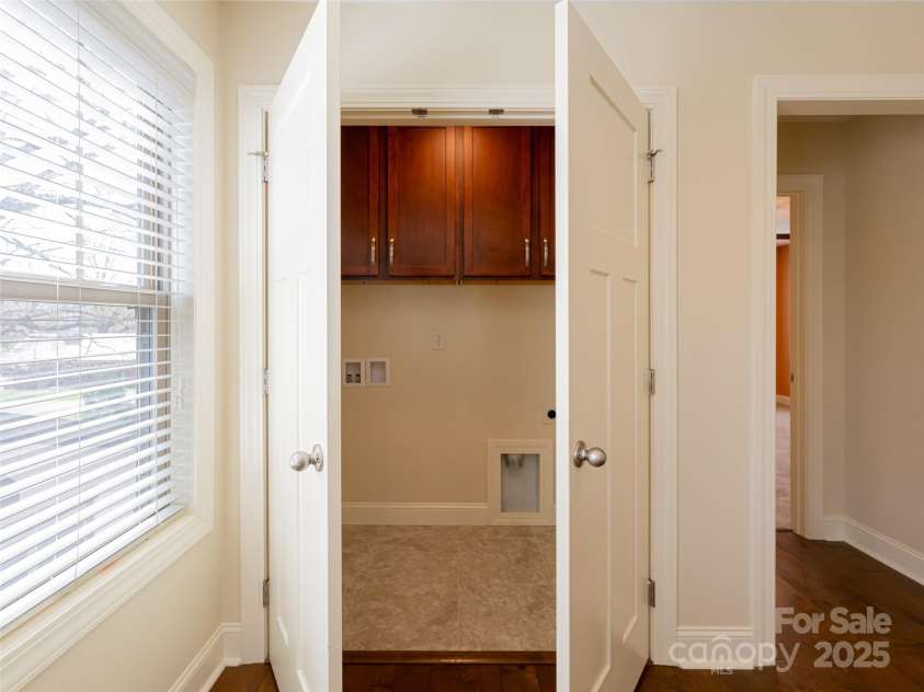 19 Tudor Way, Black Mountain, NC 28711.  MLS# CAR4248012, YatesRealty ID 15755. Upper Laundry Area with storage