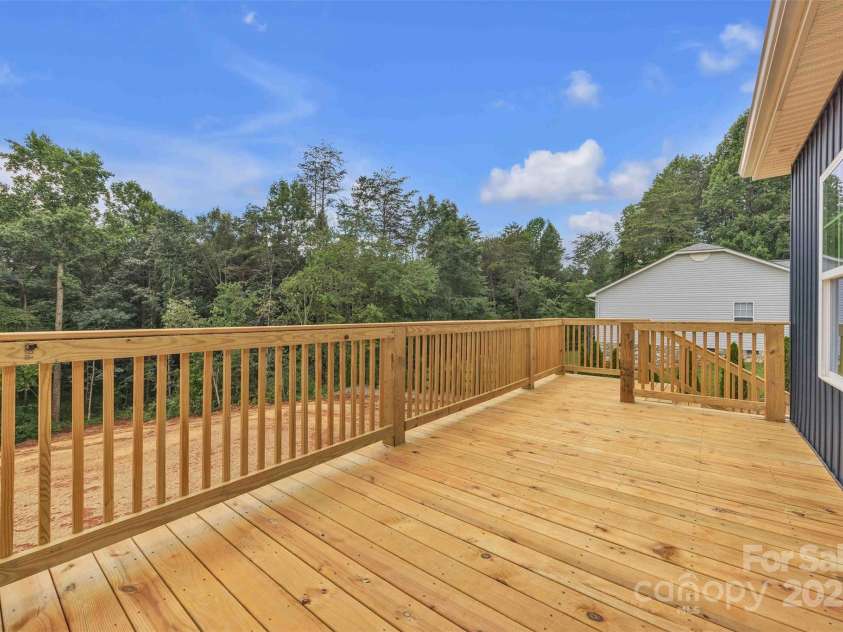 85 Cornerstone Drive, Taylorsville, NC 28681.  MLS# CAR4250711, YatesRealty ID 15756. Spacious back deck