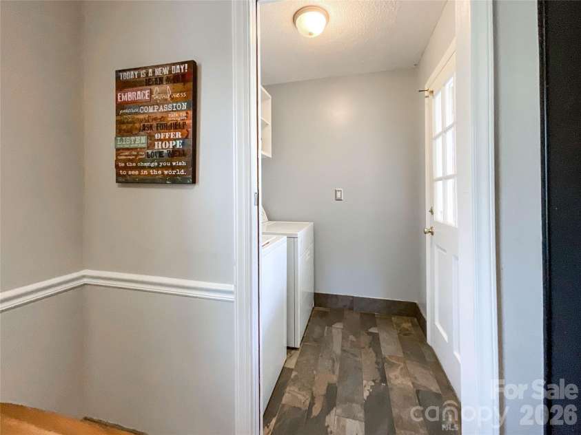 8004 Idlewild Road, Indian Trail, NC 28079.  MLS# CAR4350233, YatesRealty ID 15762. Laundry Area with Pocket Door