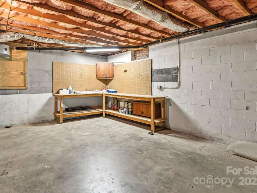 86 Hawk Haven Cove, Waynesville, NC 28786.  MLS# CAR4262787, YatesRealty ID 15765. Large Workshop area and so much storage!