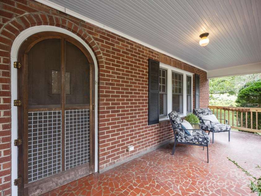 495 Fairview Road, Asheville, NC 28803.  MLS# CAR4305953, YatesRealty ID 15769. Fabulous arched door