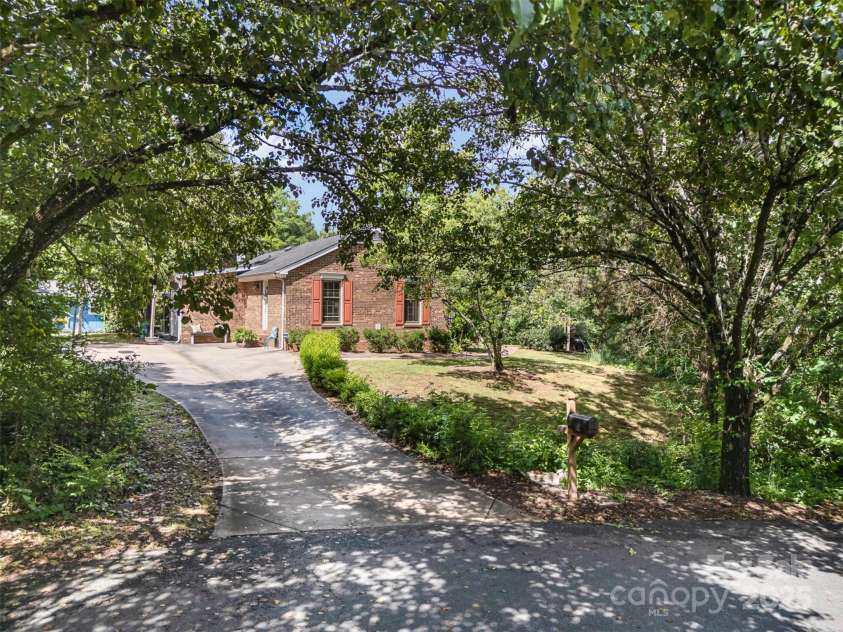 8544 Houston Ridge Road, Charlotte, NC 28277.  MLS# CAR4256177, YatesRealty ID 15774. I feature a convenient side driveway, perfect for extra parking and easy access.