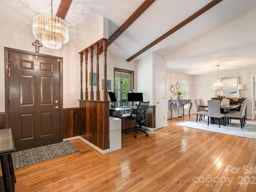 8544 Houston Ridge Road, Charlotte, NC 28277.  MLS# CAR4256177, YatesRealty ID 15774. Open entry way with high beams and wood floors.