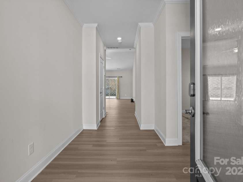 127 Tradesmen Trail, Troutman, NC 28166.  MLS# CAR4223474, YatesRealty ID 15779. The welcoming entry hall offers a warm introduction to the home, leading you past the front bedrooms and hall bath before opening up into the spacious great room. This thoughtful layout creates a smooth flow from the pr