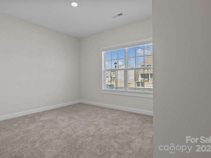 127 Tradesmen Trail, Troutman, NC 28166.  MLS# CAR4223474, YatesRealty ID 15779. Two additional bedrooms provide comfortable accommodations, each featuring plush carpeting, ample closet space, and plenty of natural light. These rooms are versatile, making them ideal for owners, guests, or a flex spa