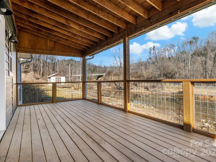 150 Westerman Street, Old Fort, NC 28762.  MLS# CAR4219635, YatesRealty ID 15793. Spacious deck and open views of Mill Creek and surrounging areas.