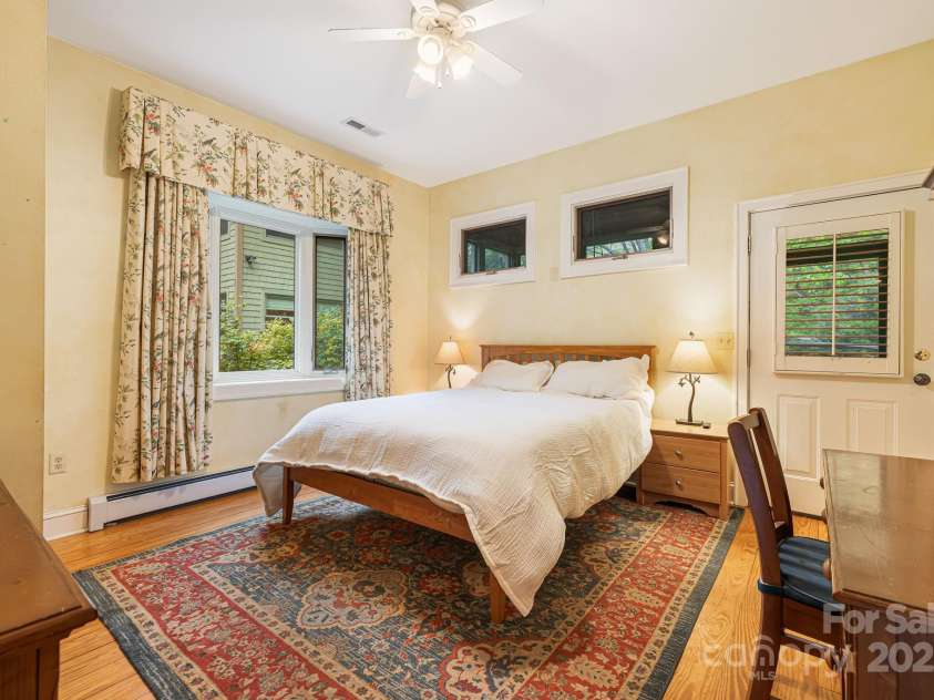 95 Carter Cove Road, Asheville, NC 28804.  MLS# CAR4254305, YatesRealty ID 15814. Bedroom with ensuite on main floor with a seperate entrance patio