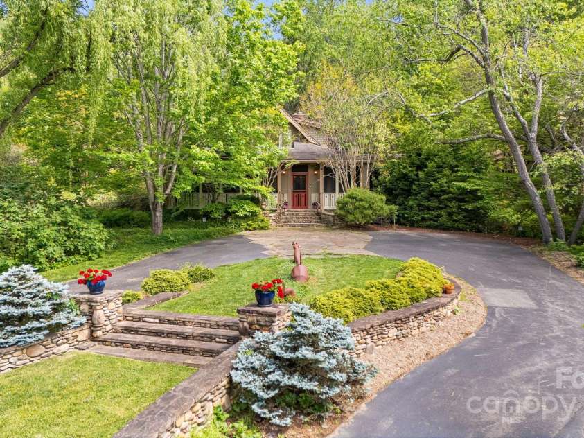 95 Carter Cove Road, Asheville, NC 28804.  MLS# CAR4254305, YatesRealty ID 15814. Circular driveway with beautiful landscaping