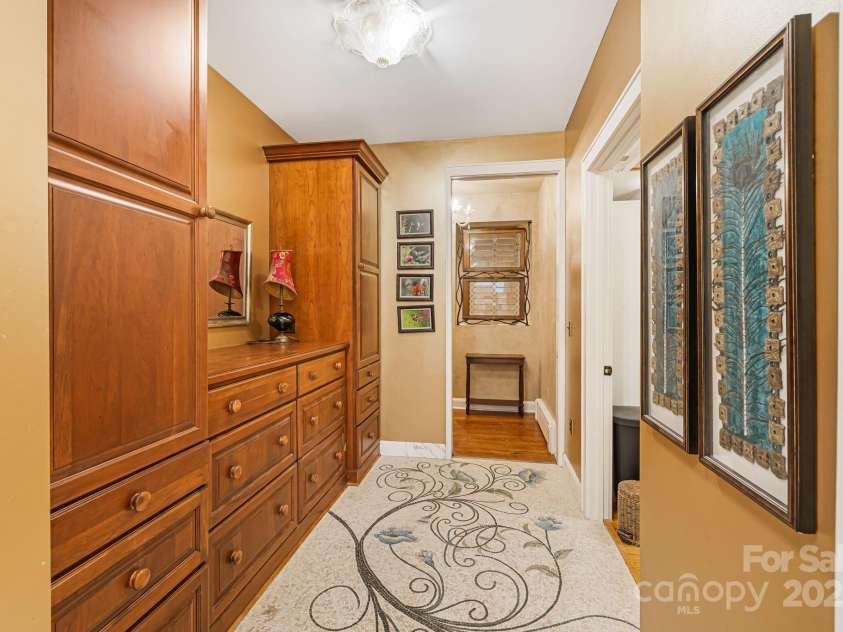 95 Carter Cove Road, Asheville, NC 28804.  MLS# CAR4254305, YatesRealty ID 15814. Dressing room adjoining expansive bathroom to large primary closet