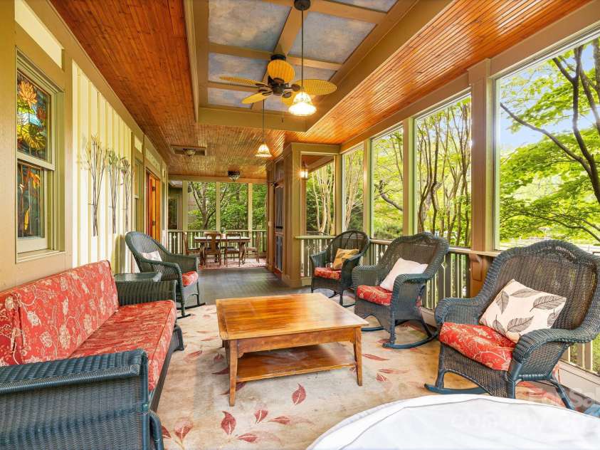 95 Carter Cove Road, Asheville, NC 28804.  MLS# CAR4254305, YatesRealty ID 15814. Screened in front porch to relax and enjoy the sound of the rushing stream