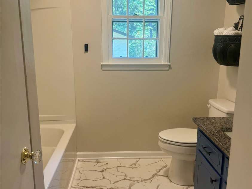 5329 Highway 27 Highway, Iron Station, NC 28080.  MLS# CAR4363221, YatesRealty ID 15820. New bathroom flooring