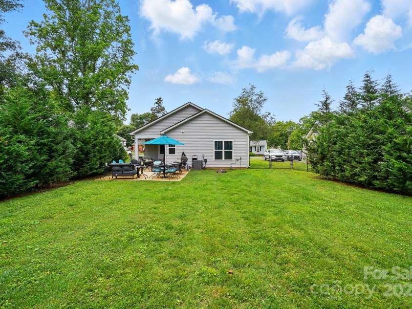204 Craig Street, Mount Holly, NC 28120.  MLS# CAR4263380, YatesRealty ID 15826. Fenced in Backyard - Privacy Trees Added