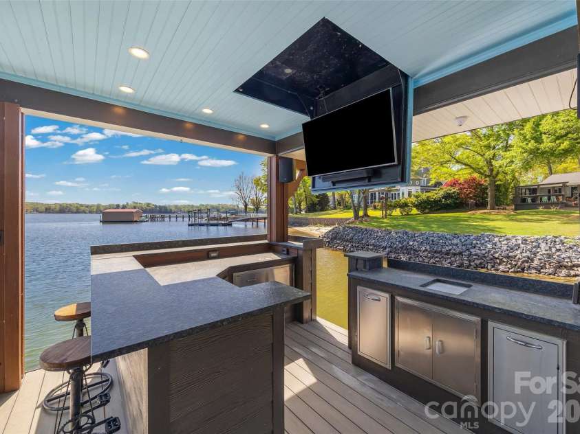 5280 Masons Ferry Road, Clover, SC 29710.  MLS# CAR4366323, YatesRealty ID 15826. Custom Dock Kitchen with TV and seating