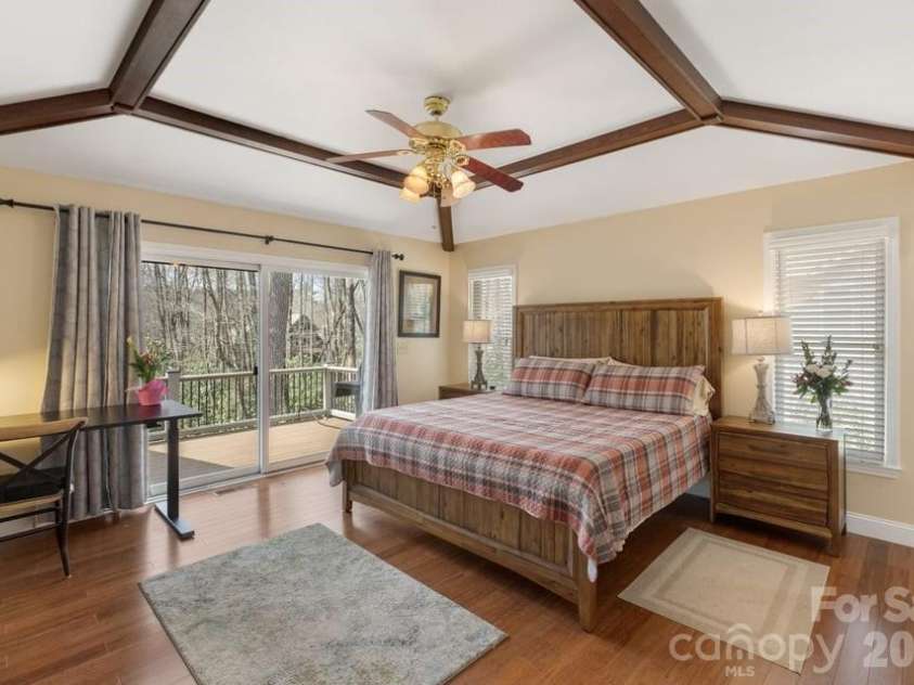 174 Garnet Rock Trail, Highlands, NC 28741.  MLS# CAR4365412, YatesRealty ID 15834. Primary Ensuite Bedroom with Deck Access