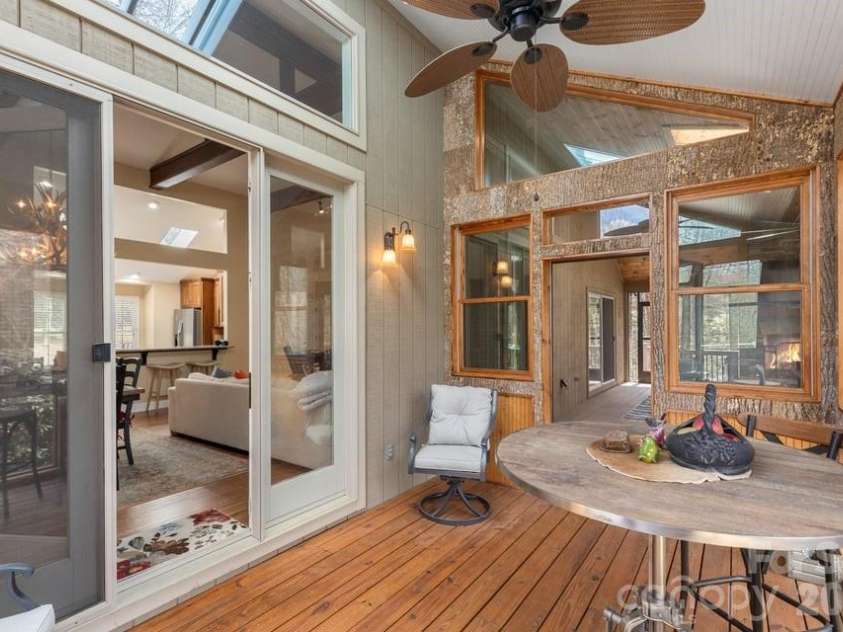 174 Garnet Rock Trail, Highlands, NC 28741.  MLS# CAR4365412, YatesRealty ID 15834. Sunroom off the Dining Area