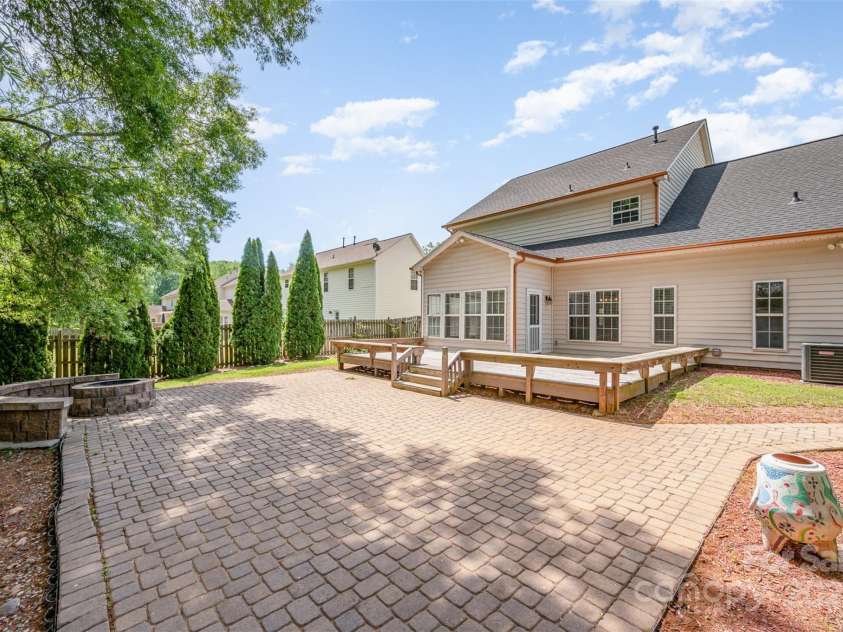 618 Circle Trace Road, Monroe, NC 28110.  MLS# CAR4245604, YatesRealty ID 15842. Back porch and extended patio w/ firepit