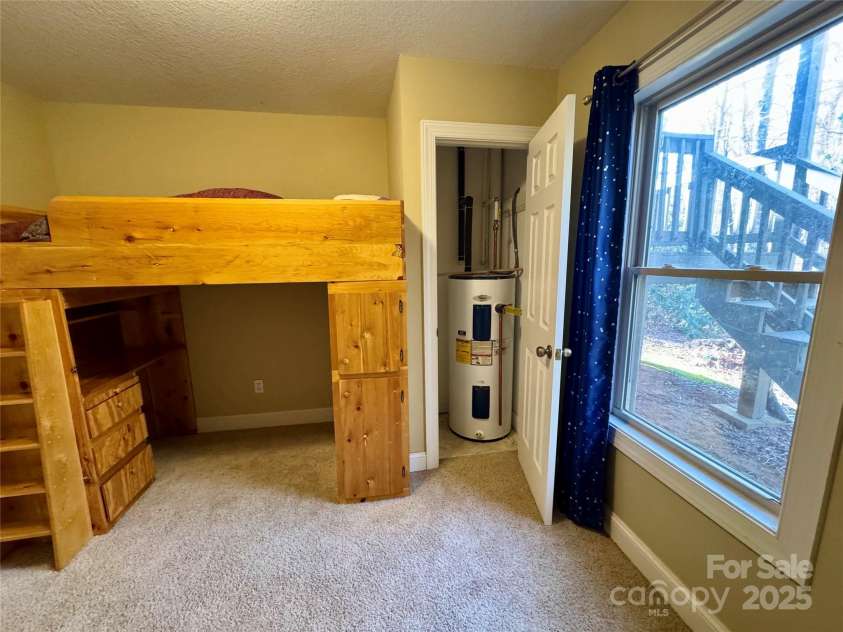 180 Dalton Lane, Black Mountain, NC 28711.  MLS# CAR4245129, YatesRealty ID 15847. Bonus room closet houses the water heater