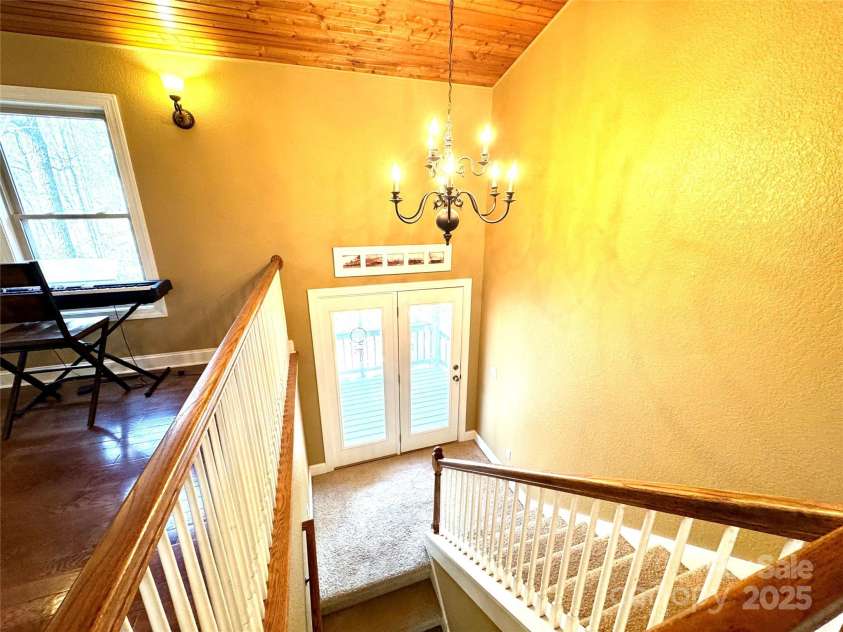 180 Dalton Lane, Black Mountain, NC 28711.  MLS# CAR4245129, YatesRealty ID 15847. Downstairs to 1st floor, game room, 2nd primary, 3rd bedroom, full bath & bonus room