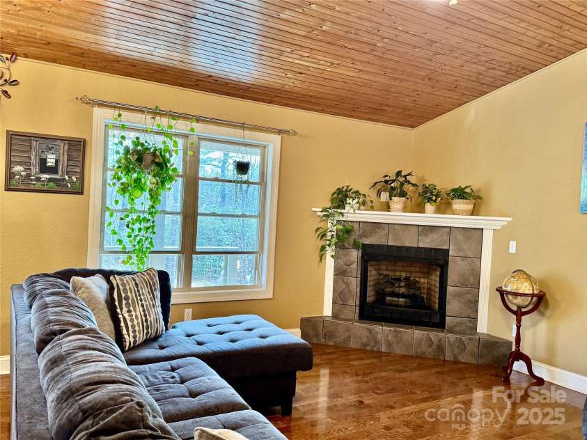 180 Dalton Lane, Black Mountain, NC 28711.  MLS# CAR4245129, YatesRealty ID 15847. Living room has gas fireplace
