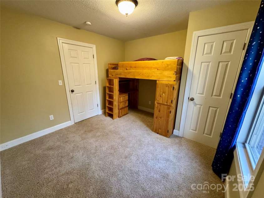 180 Dalton Lane, Black Mountain, NC 28711.  MLS# CAR4245129, YatesRealty ID 15847. Lower level bonus room has window