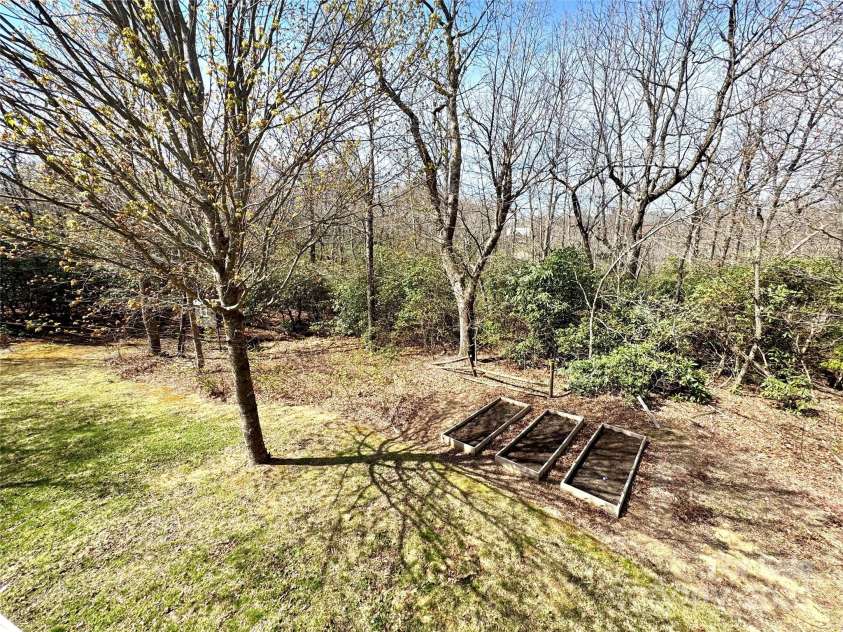 180 Dalton Lane, Black Mountain, NC 28711.  MLS# CAR4245129, YatesRealty ID 15847. Raised beds waiting for your green thumb!