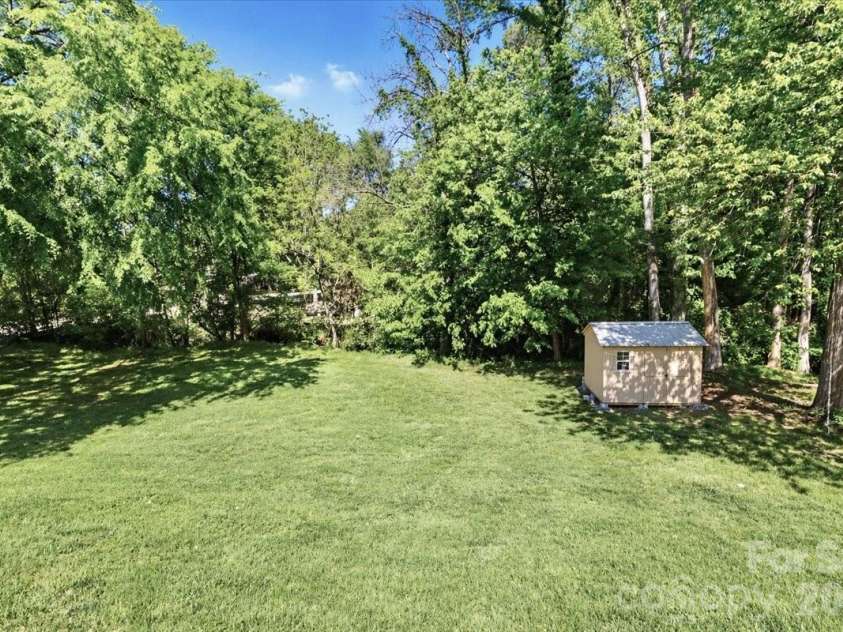 222 Cliffside Drive, Kannapolis, NC 28081.  MLS# CAR4370117, YatesRealty ID 15854. Backyard with shed