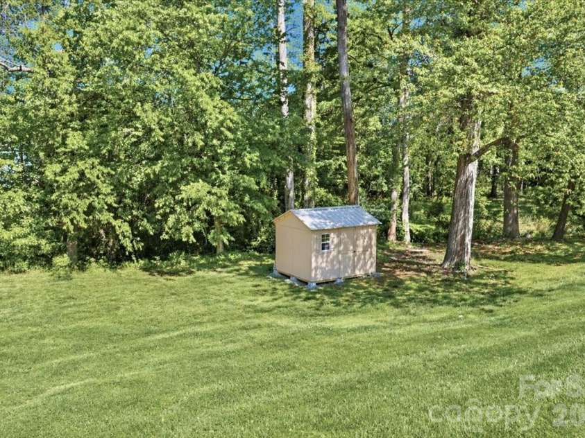 222 Cliffside Drive, Kannapolis, NC 28081.  MLS# CAR4370117, YatesRealty ID 15854. Backyard with shed