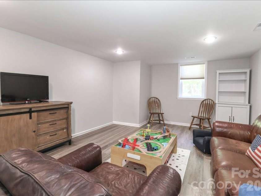 222 Cliffside Drive, Kannapolis, NC 28081.  MLS# CAR4370117, YatesRealty ID 15854. Basement family room