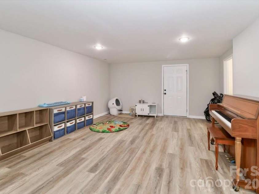 222 Cliffside Drive, Kannapolis, NC 28081.  MLS# CAR4370117, YatesRealty ID 15854. Basement family room