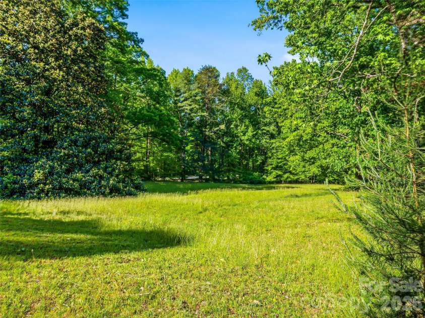 100 Hummingbird Lane, Columbus, NC 28722.  MLS# CAR4373226, YatesRealty ID 15857. Back yard