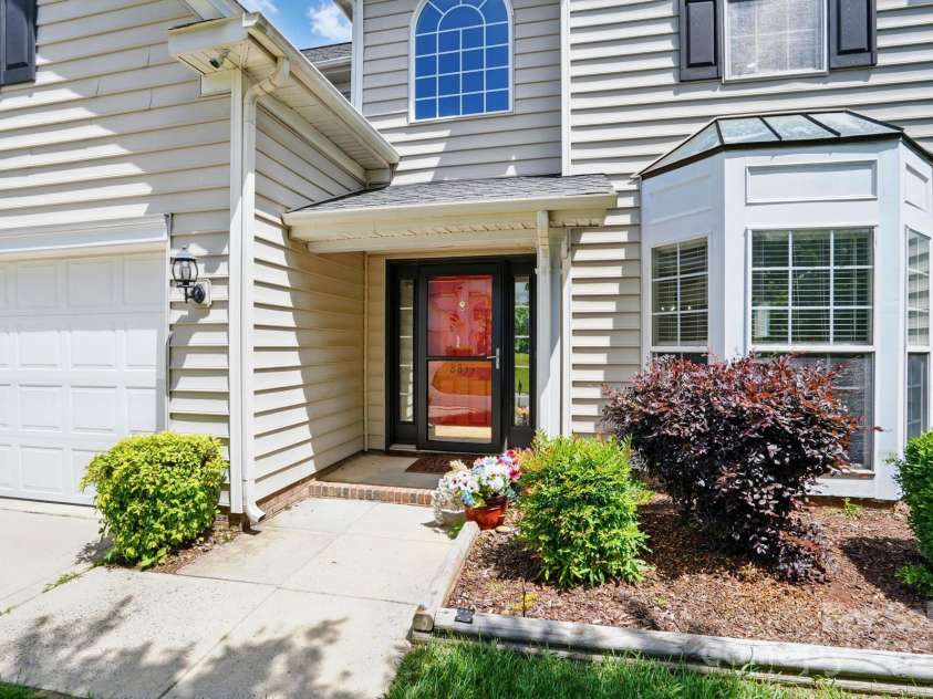 8833 Cavonnier Lane, Charlotte, NC 28216.  MLS# CAR4254092, YatesRealty ID 15858. Covered entryway