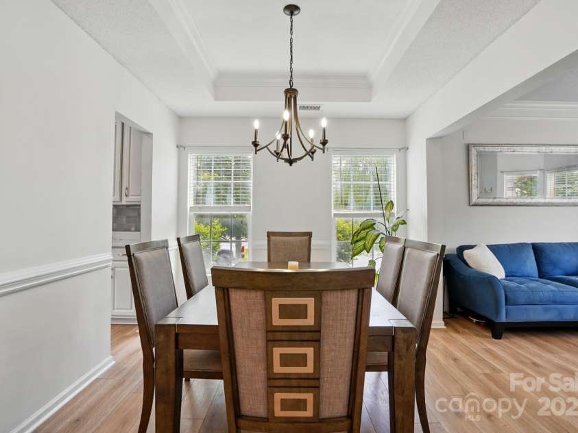 8833 Cavonnier Lane, Charlotte, NC 28216.  MLS# CAR4254092, YatesRealty ID 15858. Dining room is open with good natural light