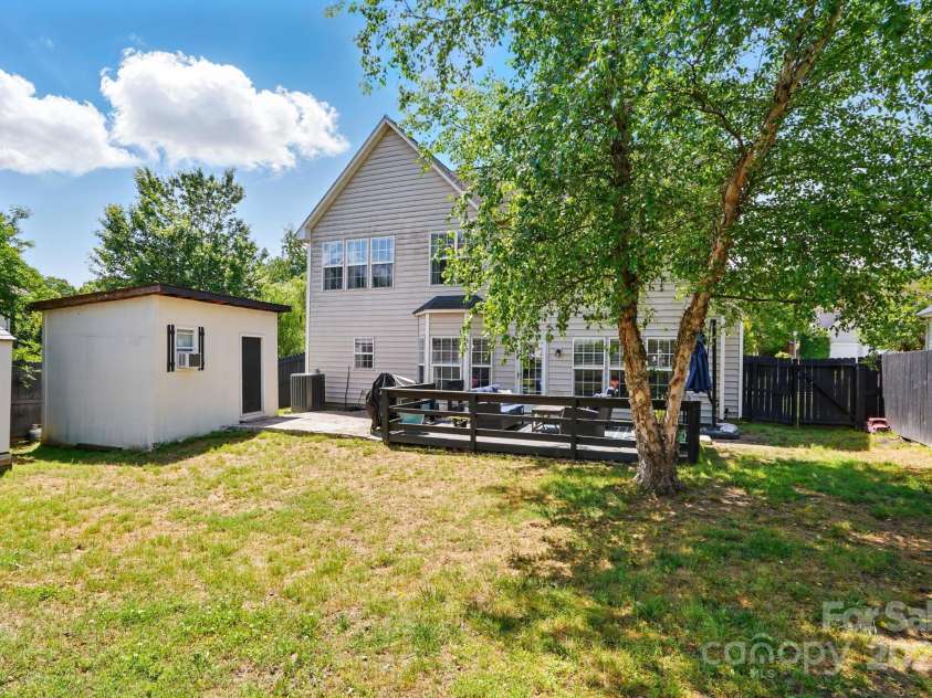 8833 Cavonnier Lane, Charlotte, NC 28216.  MLS# CAR4254092, YatesRealty ID 15858. Large backyard