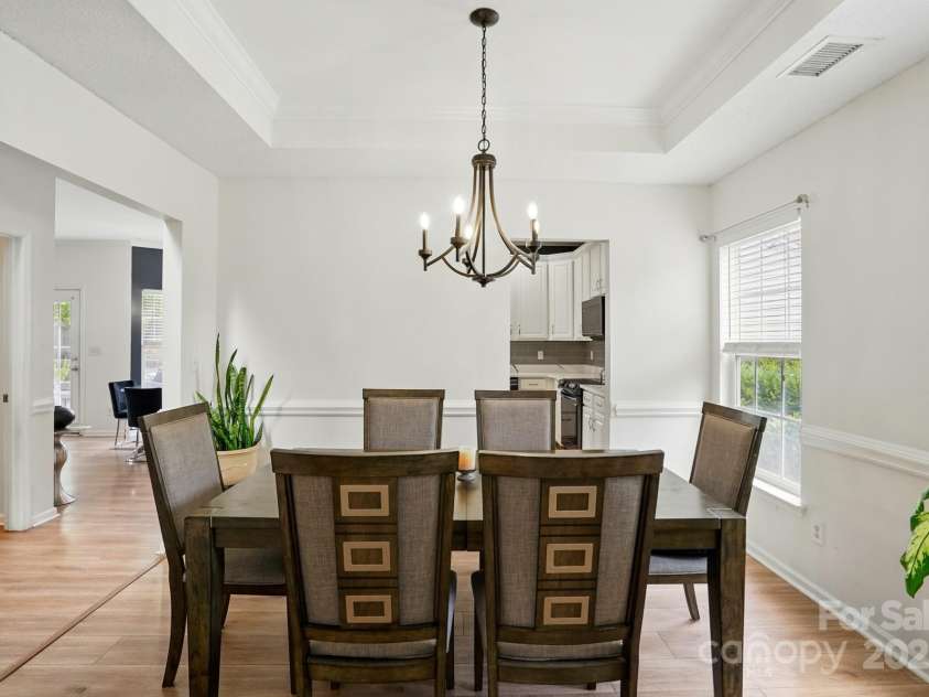 8833 Cavonnier Lane, Charlotte, NC 28216.  MLS# CAR4254092, YatesRealty ID 15858. Tray ceiling in the dining room