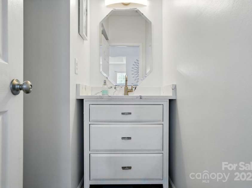 8833 Cavonnier Lane, Charlotte, NC 28216.  MLS# CAR4254092, YatesRealty ID 15858. Upgraded half bath vanity