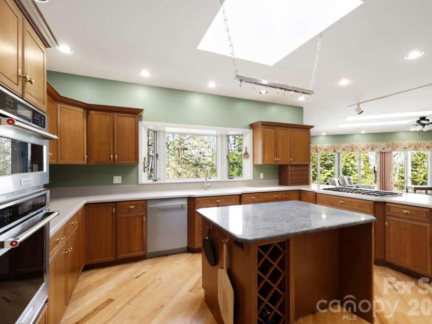 100 Elmridge Drive, Flat Rock, NC 28731.  MLS# CAR4366738, YatesRealty ID 15859. Bright kitchen with skylights