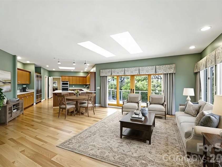 100 Elmridge Drive, Flat Rock, NC 28731.  MLS# CAR4366738, YatesRealty ID 15859. Den/Kitchen virtually staged