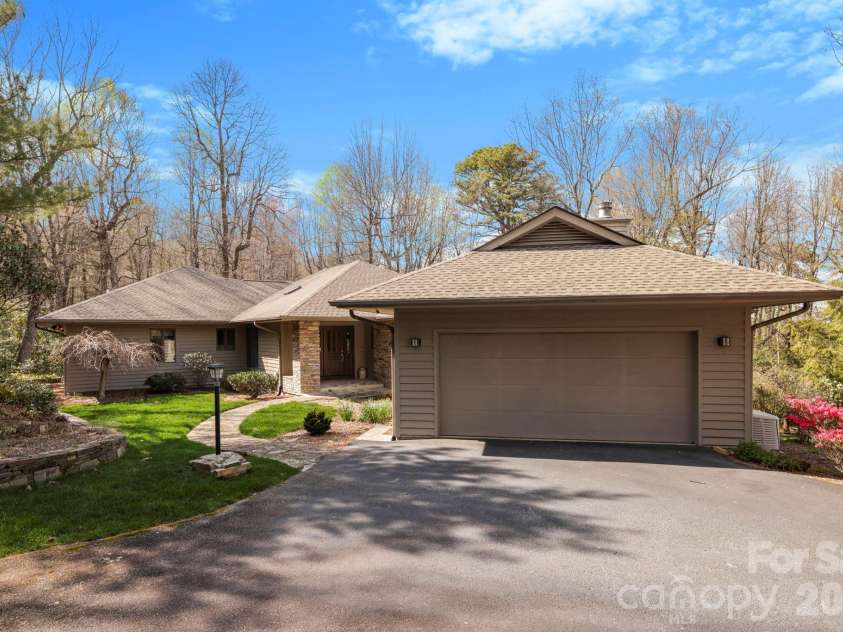 100 Elmridge Drive, Flat Rock, NC 28731.  MLS# CAR4366738, YatesRealty ID 15859. Gorgeous property surrounding this home with many custom touches