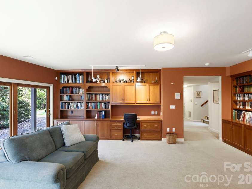100 Elmridge Drive, Flat Rock, NC 28731.  MLS# CAR4366738, YatesRealty ID 15859. Large window overlooking patio and nature