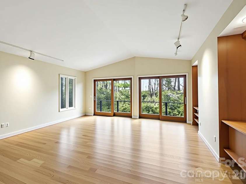 100 Elmridge Drive, Flat Rock, NC 28731.  MLS# CAR4366738, YatesRealty ID 15859. Living room virtually cleared