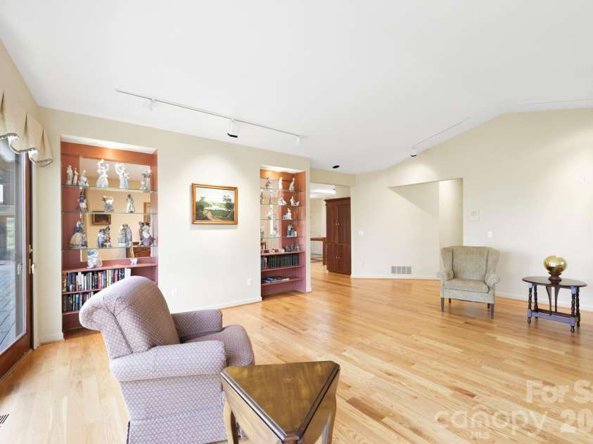100 Elmridge Drive, Flat Rock, NC 28731.  MLS# CAR4366738, YatesRealty ID 15859. Living room with vaulted ceiling