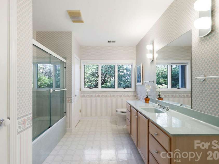 100 Elmridge Drive, Flat Rock, NC 28731.  MLS# CAR4366738, YatesRealty ID 15859. Lower level bathroom