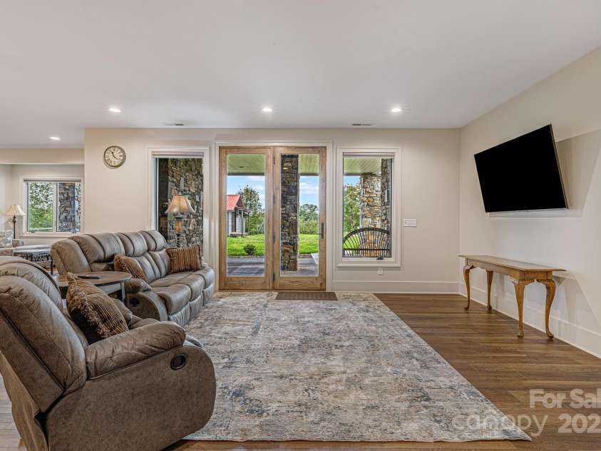 360 Turkey Branch Road, Mars Hill, NC 28754.  MLS# CAR4218460, YatesRealty ID 1586. Downstairs entrance from the backyard. Media area.