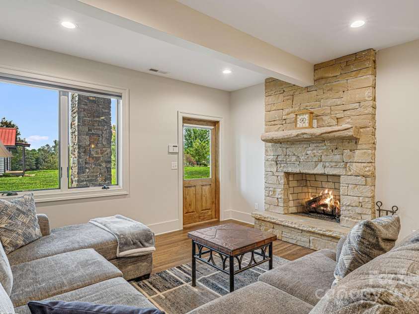 360 Turkey Branch Road, Mars Hill, NC 28754.  MLS# CAR4218460, YatesRealty ID 1586. Downstairs living room.