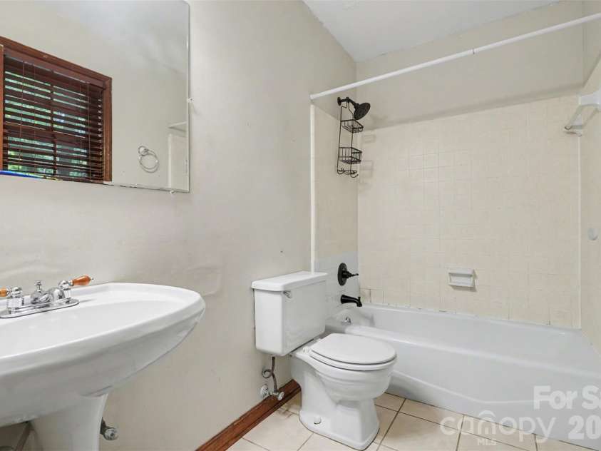 5921 Senconee Road, Matthews, NC 28104.  MLS# CAR4372440, YatesRealty ID 15862. 