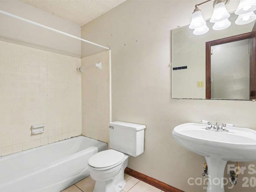 5921 Senconee Road, Matthews, NC 28104.  MLS# CAR4372440, YatesRealty ID 15862. 
