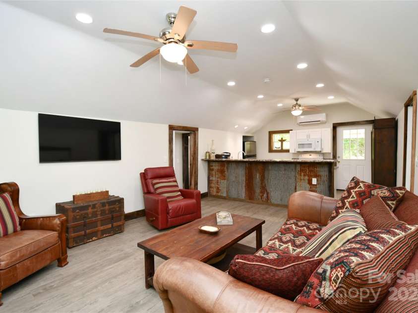 2180 Pigeon Roost Road, Green Mountain, NC 28740.  MLS# CAR4137054, YatesRealty ID 1587. Classy interior remodel -- living room